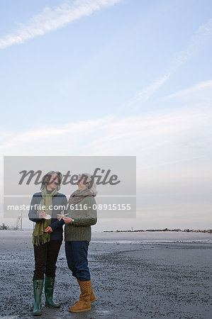Mature women standing on a beach