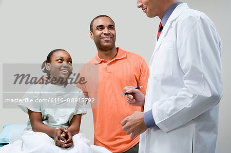 Father and daughter with doctor