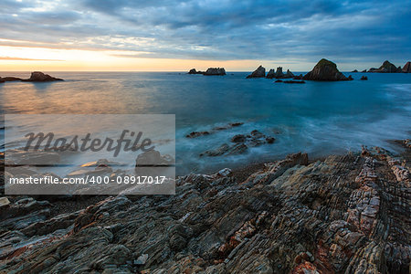 Evening Atlantic ocean coastline landscape. Beautiful Gueirua beach with sharp islets. Asturias, Spain.