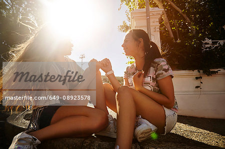 Teenage girls having fun in residential street, Cape Town, South Africa