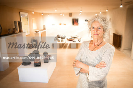 Portrait of woman in ceramics gallery