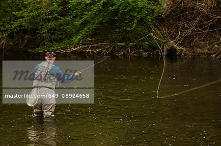 Man fishing in river