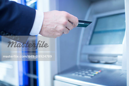 Man using cash machine