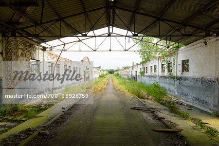 Roof framework over road and old decayed buildings in Mecklenburg Vorpommern, Germany Roof framework over road and old decayed buildings in Mecklenburg Vorpommern, Germany