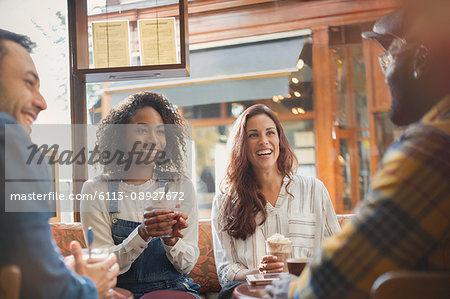 Friends hanging out drinking hot chocolate in cafe