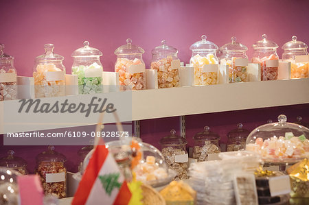 Turkish sweets arranged on shelf in shop