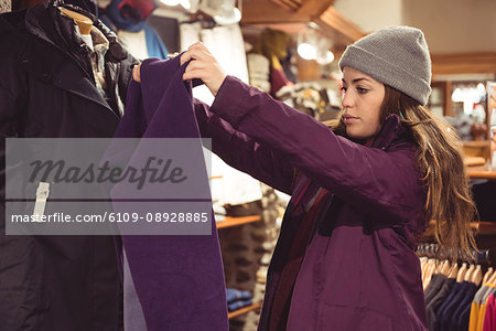 Woman selecting apparel in a clothes shop
