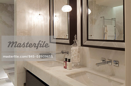 A luxurious bathroom in a central London apartment in Knightsbridge. Mirrors.