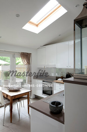 White kitchen with a view of the garden