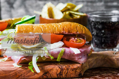 Ham, gherkin and tomato sandwich