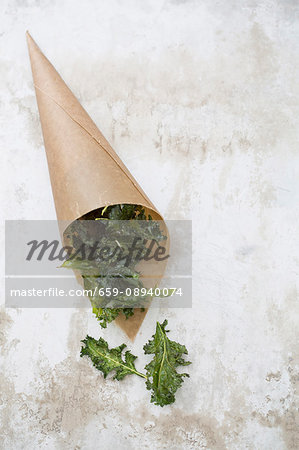 Kale crisps in a brown paper bag