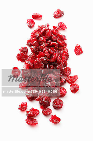 Dried cranberries on a white surface Dried cranberries on a white surface