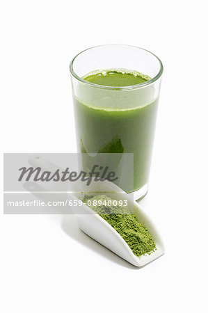 A green smoothie with wheatgrass powder A green smoothie with wheatgrass powder