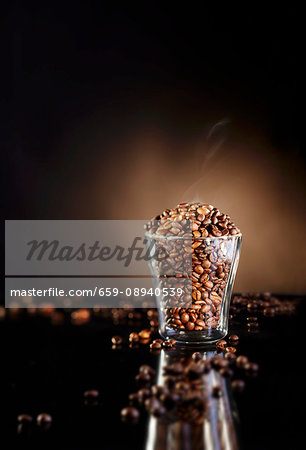 A glass of freshly roasted coffee beans A glass of freshly roasted coffee beans