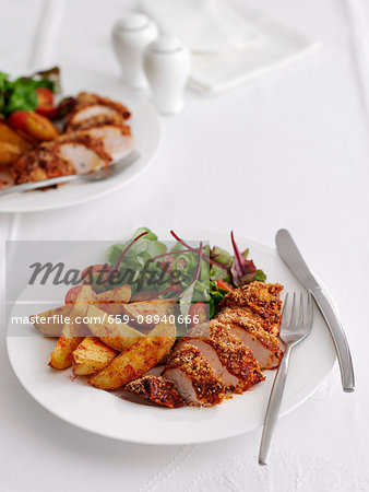 Breaded Maryland chicken with potato wedges and salad