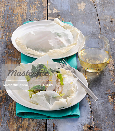 Fish with vegetables in parchment paper