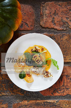 Raw marinated Muscade de Provence squash with macadamia nut oil and walnuts