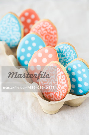 Colourful Easter egg biscuits in an egg box