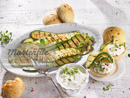 Marinated grilled courgettes with a sheep's cheese sauce and bread rolls Marinated grilled courgettes with a sheep's cheese sauce and bread rolls