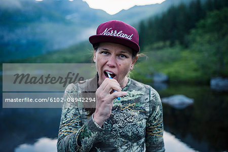 Hiker brushing teeth