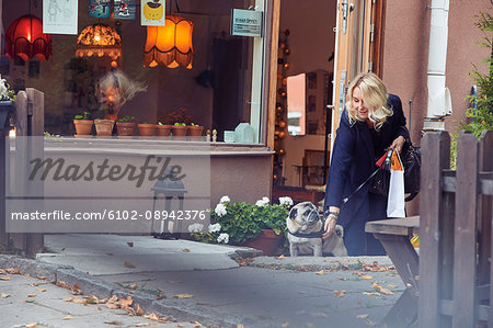 Woman walking dog