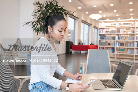 Young woman in library