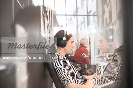 Woman using laptop in office