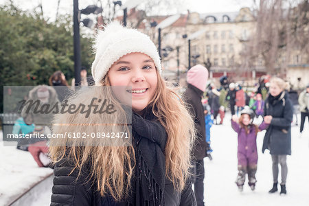 Smiling girl on ice rink