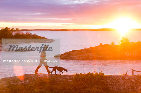 Man with dog by lake Man with dog by lake