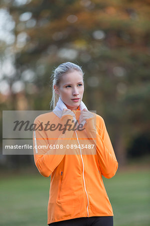 Portrait of a pretty blonde woman doing sport in park