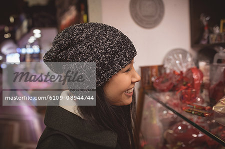 Smiling woman standing in the supermarket