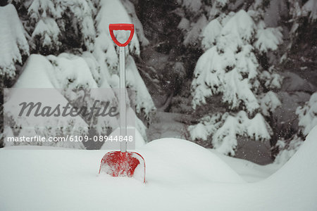 Shovel in a snowy landscape during winter