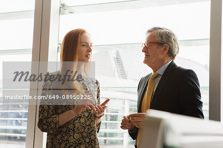 Businessman and businesswoman having discussion