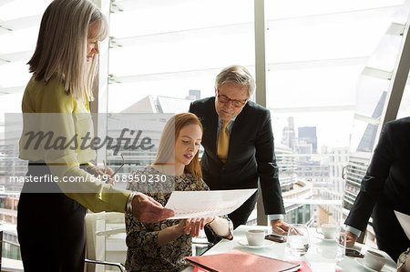 Business colleagues having meeting, London, UK