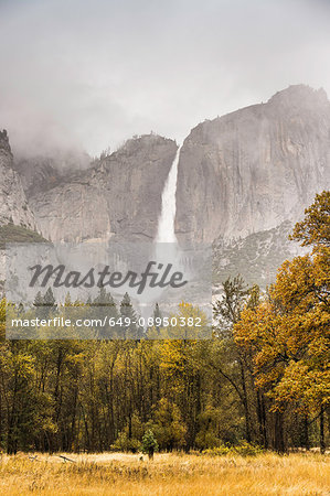 Landscape with distant misty waterfall, Yosemite National Park, California, USA