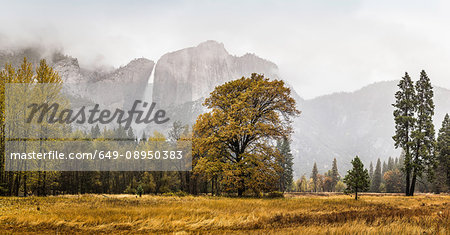 Landscape with distant misty waterfall, Yosemite National Park, California, USA Landscape with distant misty waterfall, Yosemite National Park, California, USA