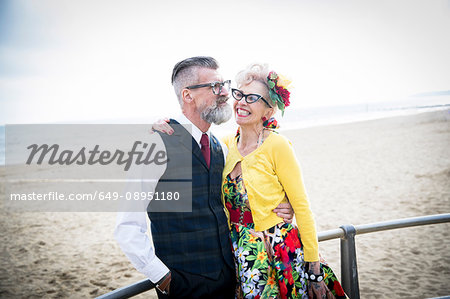 Happy 1950's vintage style couple at beach