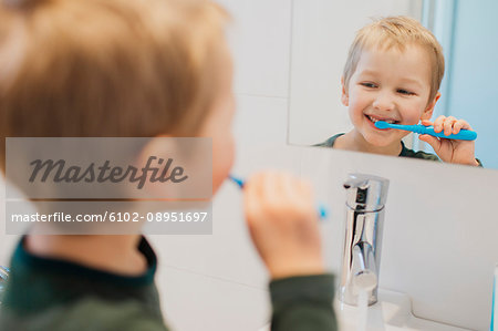 Boy brushing teeth