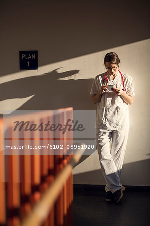 Female doctor using smartphone