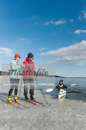 People kayaking and skiing