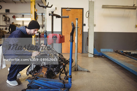 Mechanic checking a car parts