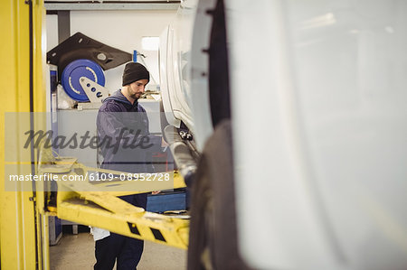 Mechanic examining a car