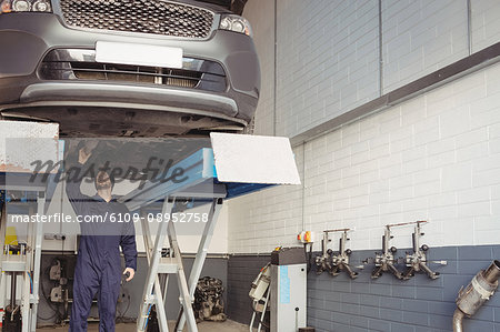 Mechanic examining a car