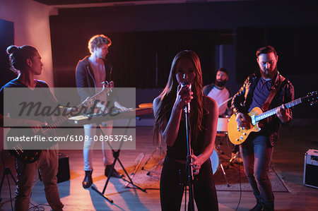 Band performing in recording studio