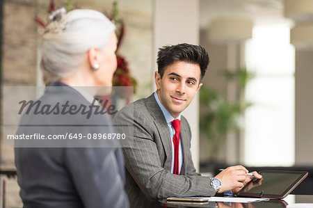 Businessman meeting with female colleague in boardroom meeting