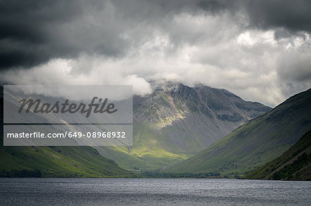 Storm clouds over Goat Crag across Buttermere lake, The Lake District , UK
