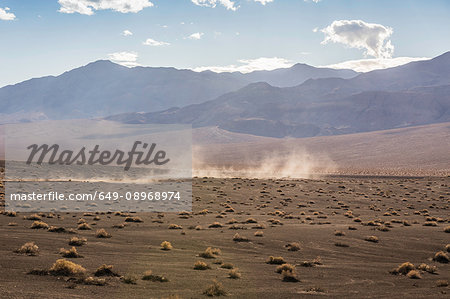 Landscape and dust storm at Ubehebe Crater in Death Valley National Park, California, USA