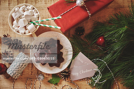 Overhead view of christmas decorations, hot chocolate and cookies