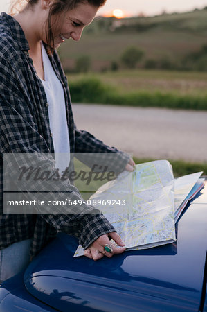 Tourist reading road map