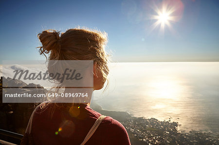 Young woman on top of Table Mountain, looking at view, Table Mountain, Cape Town, South Africa
